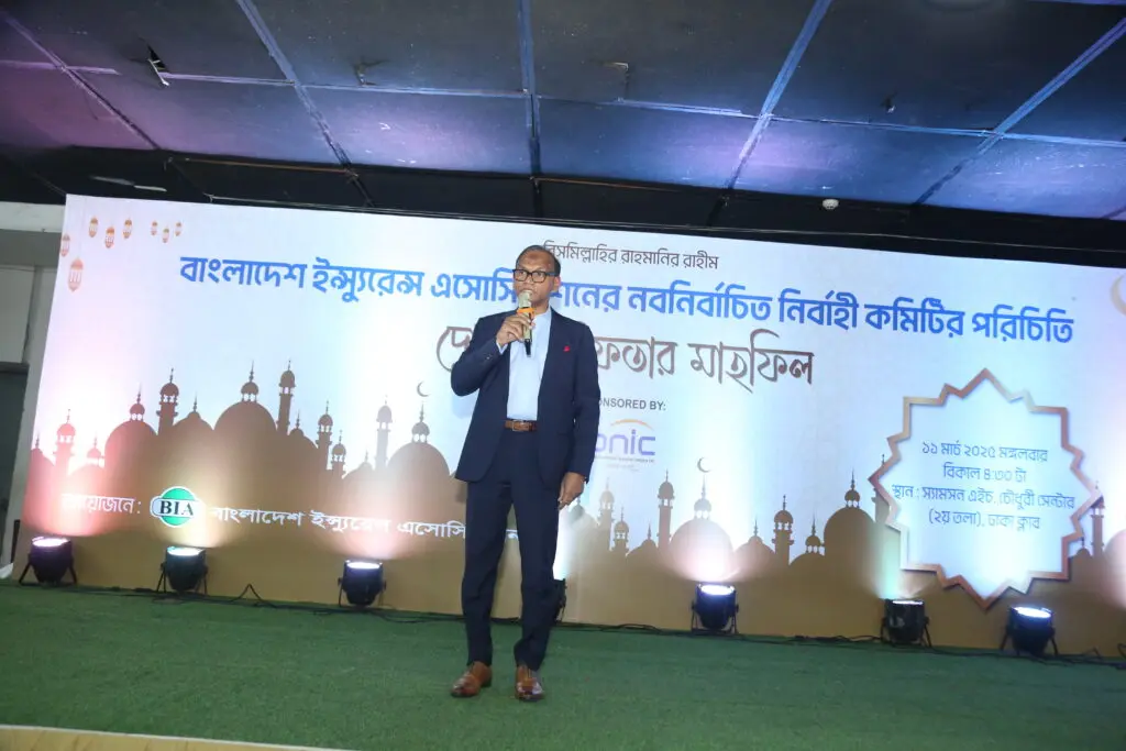 Speaker addressing a Bangladesh Insurance Association gathering on stage